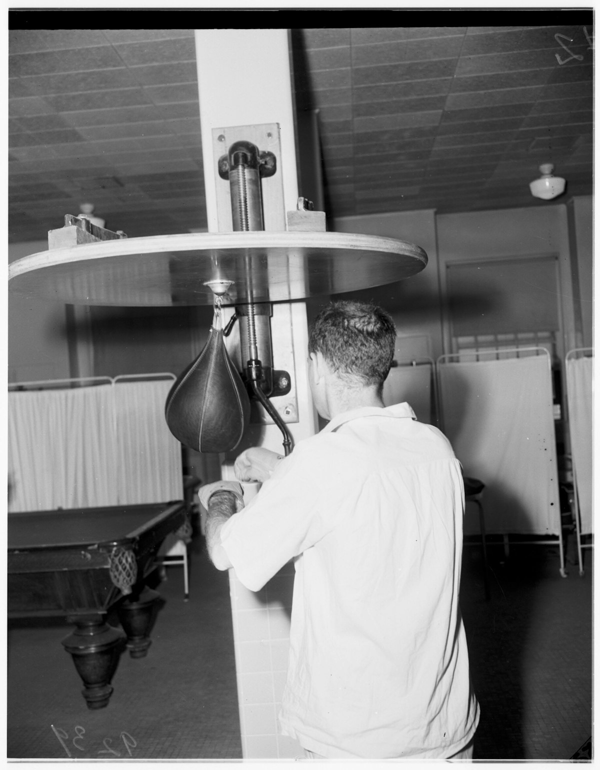 A VA patient hits a punching bag at the West Los Angeles Veterans Administration.