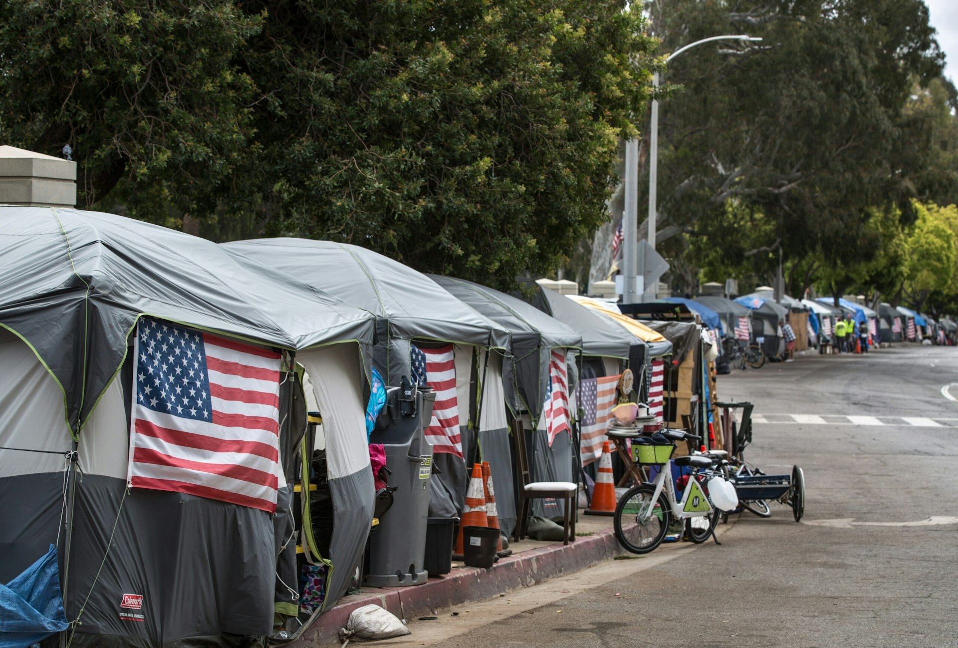 Dozens of tents adorned with American flags line San Vicente Boulevard in Los Angeles.