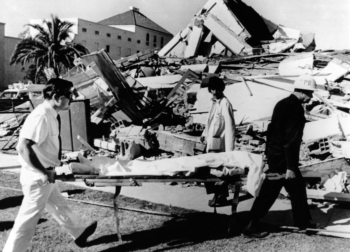 An injured patient from the leveled Veterans Administration Hospital is evacuated after a major earthquake.