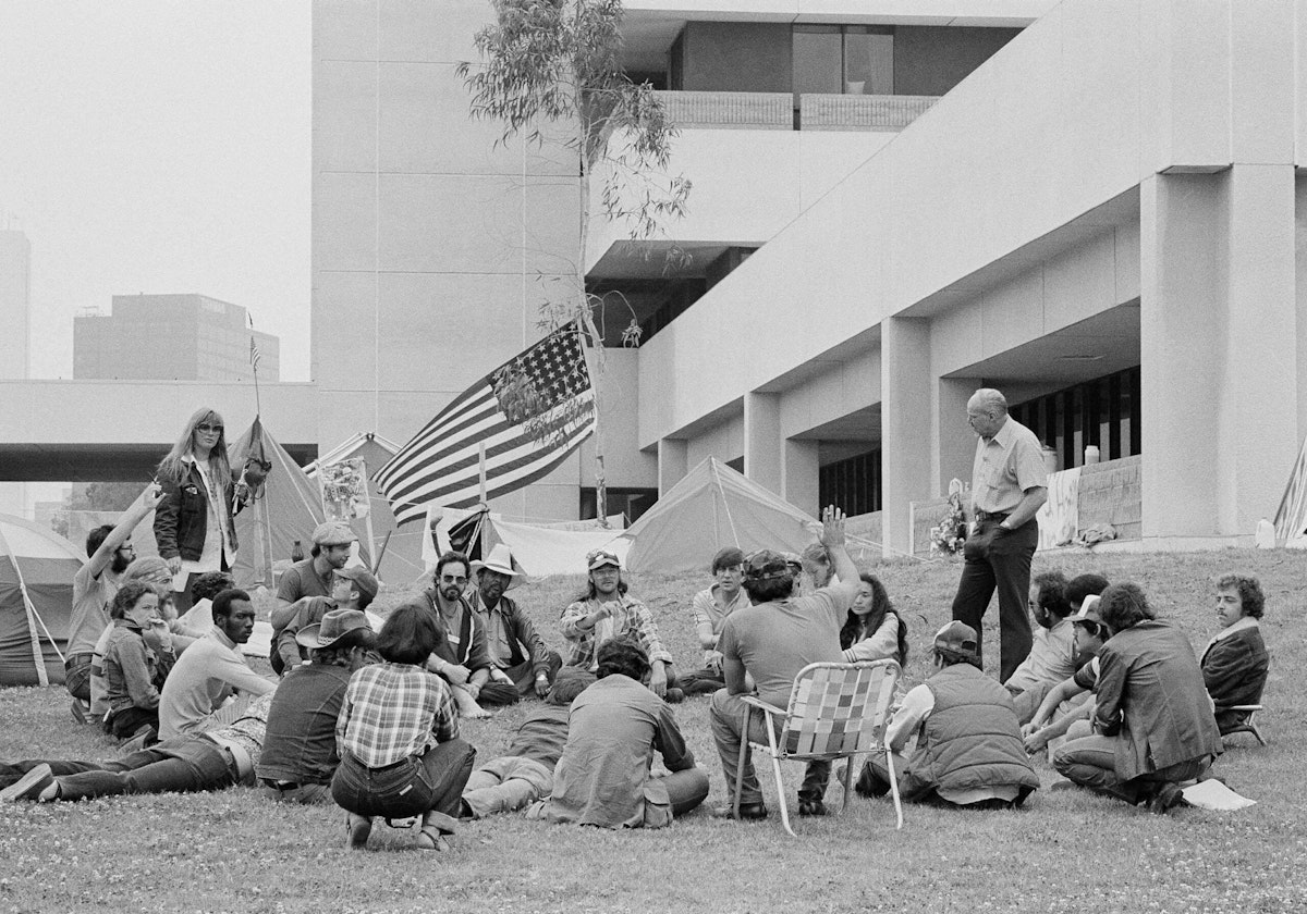 Vietnam veterans participating in a hunger strike meet on the grass outside the Wadsworth Veterans Administration in Los Angeles.