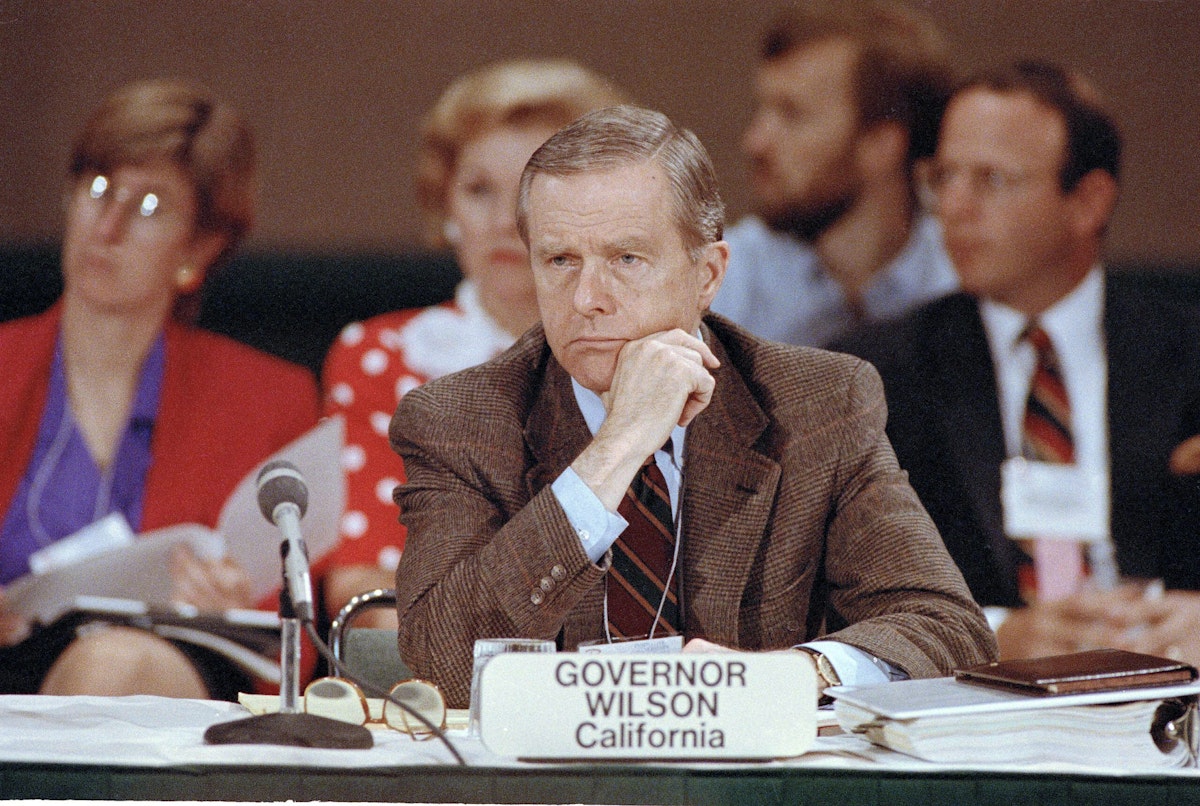 California Gov. Pete Wilson listens during a discussion on health care at the opening session of the 83rd National Governors’ Association annual meeting in Seattle, Aug. 17, 1991.