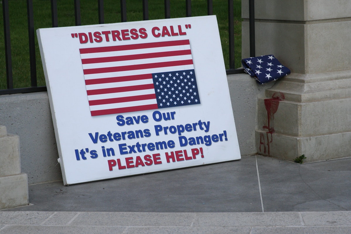 One of the signs used by veterans during their long-running peaceful protest sits outside the VA facility.