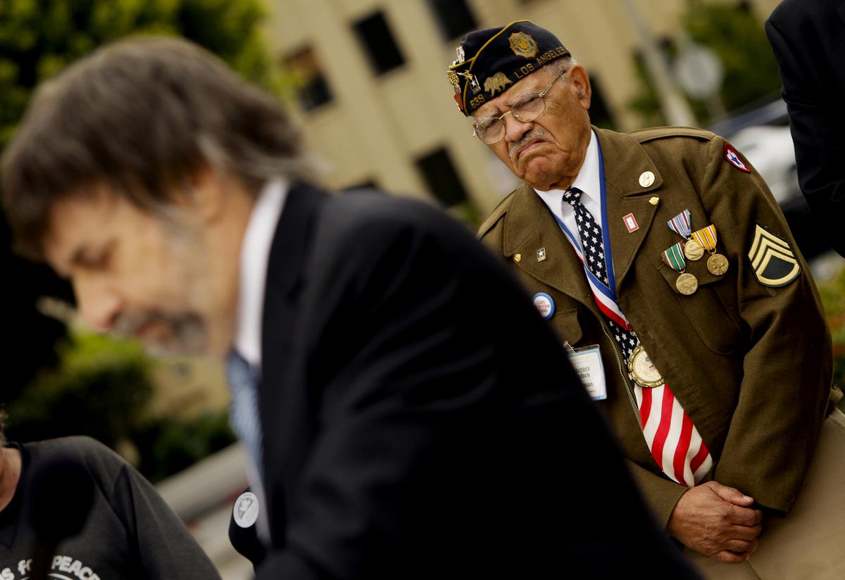 Mark Rosenbaum, chief counsel of the ACLU Foundation of Southern California, speaks as veteran Stephen E. Sherman listens at a press conference in 2011.