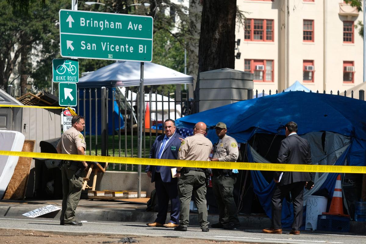 Police tape surrounds a homeless encampment outside the West LA VA.