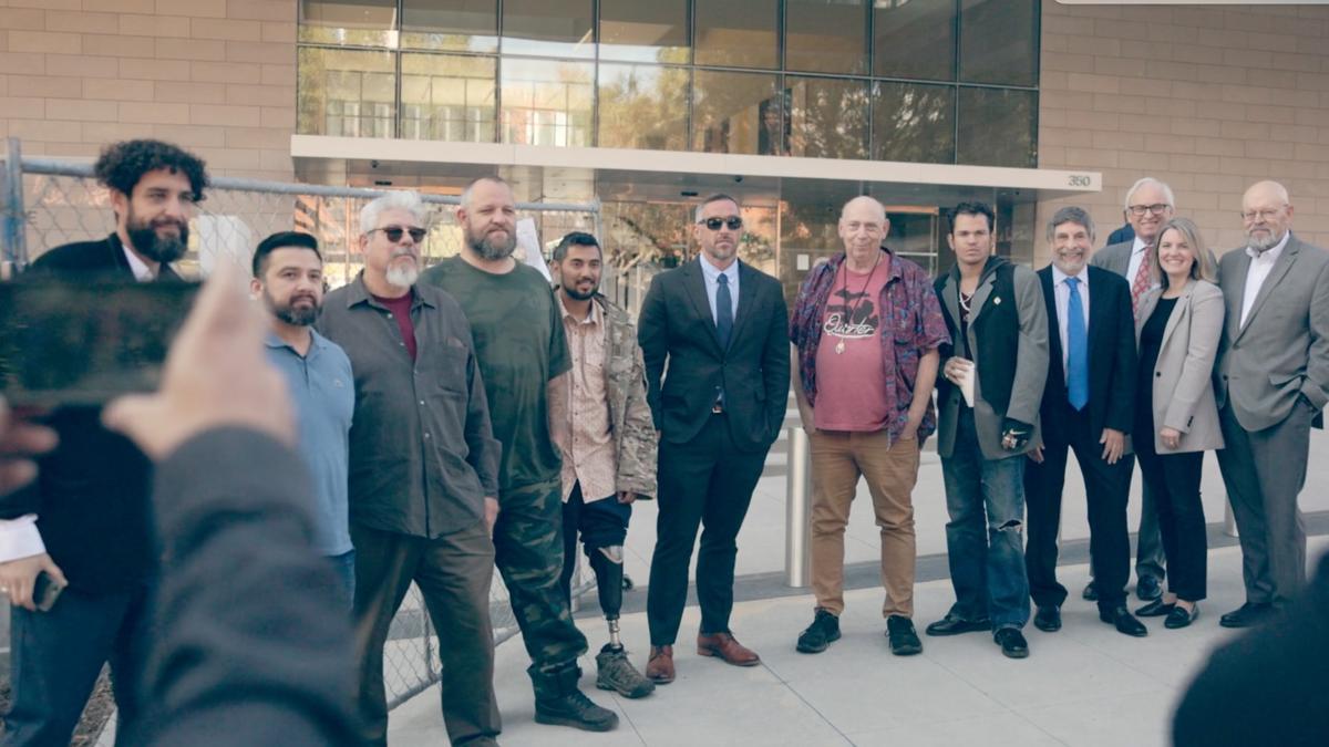 Members of the Powers v. McDonough lawsuit gather in front of the First Street U.S. Courthouse on December 14, 2023.