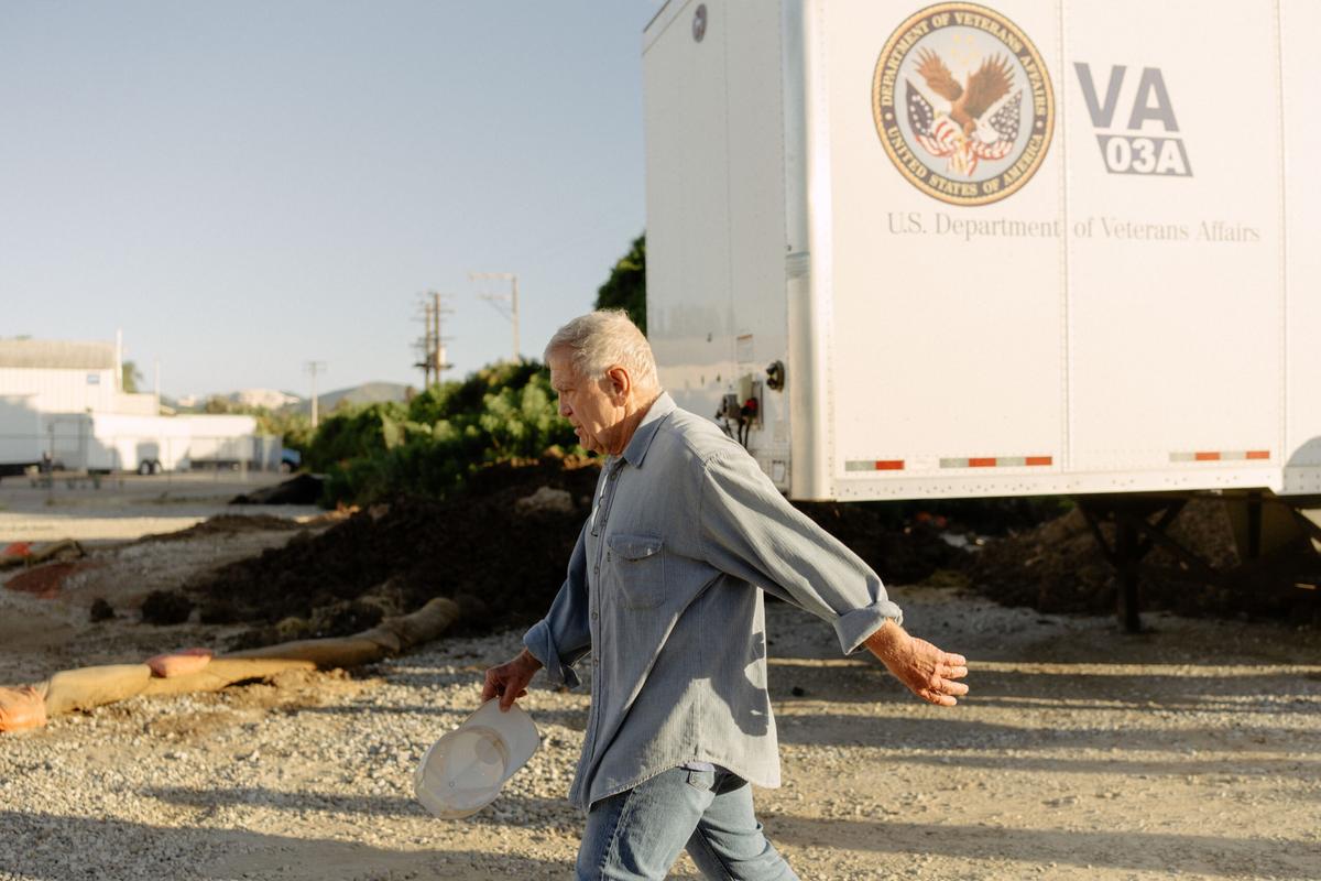 Judge David O. Carter takes steps to calculate acreage from the 405 freeway at the Breitburn oil drilling site on a group tour on Wed., Aug. 21, 2024, in Los Angeles, Calif.